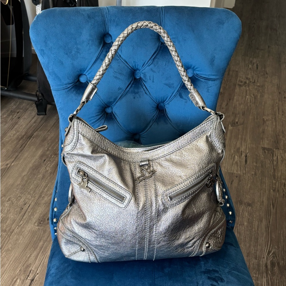 The Sak Peace Collection Silver Metallic Leather bag with doves & peace signs.